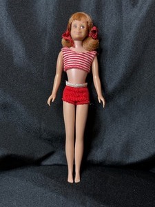 lot 75 image: VINTAGE SKOOTER WEARING SWIMSUIT
