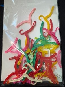 lot 188 image: LOT OF VINTAGE BARBIE CLOTHES HANGERS