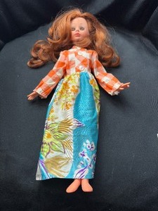 lot 259 image: RED HAIRED DOLL MARKED 1968 ON BACK WITH OUTFIT