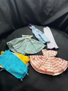 lot 262 image: MIXED LOT OF DOLL CLOTHING ITEMS