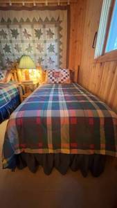 lot 96 image: Twin Size Bed with Plaid Quilt and Matching Skirt