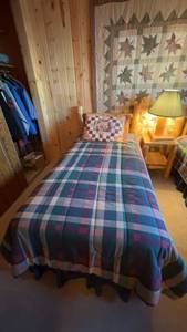 lot 97 image: Twin Size Bed with Colorful Plaid Quilt and Decorative Pillow