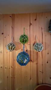 lot 106 image: Set of 4 Decorative Glass Float Balls in Netting
