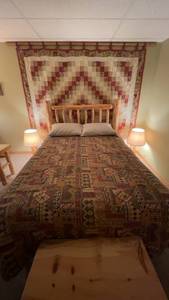 lot 155 image: Queen Size Rustic Log Bed with Bedding Set