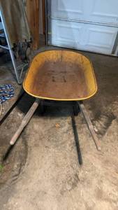 lot 193 image: Used Yellow Wheelbarrow with One Wheel