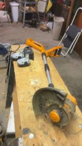 lot 215 image: WORX Cordless String TrimmerEdger with 2 Batteries and Extra Spools