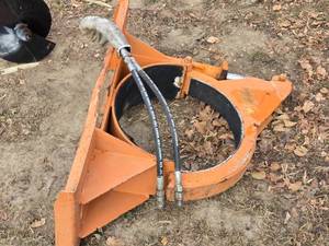 lot 12 image: Used Hydraulic Barrel Grabber Attachment with Hoses for Skid Loader