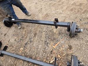 lot 25 image: One Heavy-Duty Trailer Axle with Electric Brakes - Model 76314F10D8EZ - Hub Face 93, Outside of Bracket 63.25,