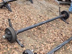 lot 32 image: One Dexter Spring Axel 6000lbs Capacity, Outside Springs  82.5 Inches, Hub Face Approx. 96