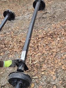 lot 34 image: One Dexter 6000 lbs Capacity Trailer Axle with Brakes Hub Face 93.37, Outside of Bracket 78
