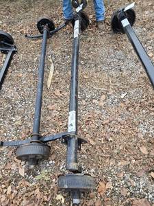 lot 39 image: One Dexter 37112F225U5E Axle Assembly with Brake Drums - 3500 lbs Capacity, Hub Face93, Outside Brackets71.5