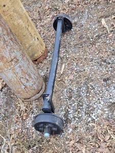 lot 42 image: One Dexter Axle Assembly with Brakes, Hub Face 66.78, Outside Brackets  52.78