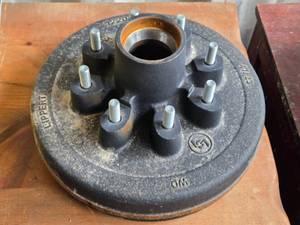 lot 45 image: New  12-inch Cast Iron Lippert Hub Assembly with 2.5-inch Hub Diameter