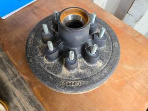 lot 48 image: New 12-inch Cast Iron Lippert Hub Assembly with 2.5-inch Hub Diameter