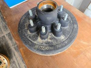 lot 49 image: New 12-inch Cast Iron Lippert Hub Assembly with 2.5-inch Hub Diameter