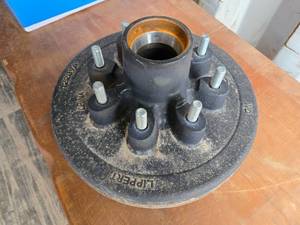 lot 50 image: New 12-inch Cast Iron Lippert Hub Assembly with 2.5-inch Hub Diameter