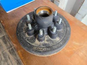 lot 51 image: New 12-inch Cast Iron Lippert Hub Assembly with 2.5-inch Hub Diameter