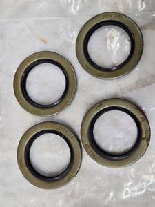 lot 235 image: Set of 4 Trailer Axel Seals (3 58 Outside Diameter, 2 14 Inside Diameter)