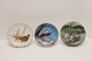lot 64 image: Nature Collectors Plates- Woodland Haven Enesco 1976, Winter Solitude By David Maass, The Pintail by Bart Jerner