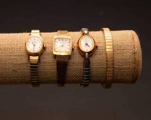 lot 66 image: Gold Toned Timex Watches and Watch Band