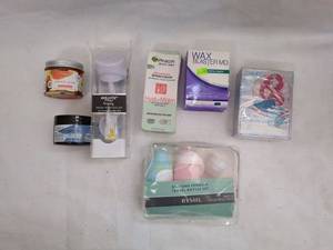 lot 93 image: Lot of 8 Personal Care Items including Hydrogel, Travel Bottles, and Wax Blaster MD