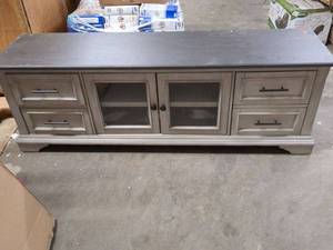 lot 24 image: Vintage Two-Tone Media Console with Glass Doors and Storage