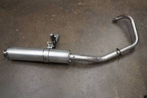 lot 27 image: Motorcycle Headpipe with Muffler and Foot Peg