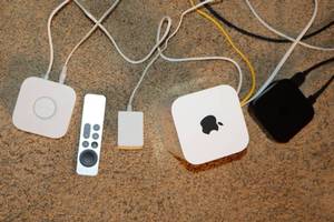 lot 25 image: Apple TV, Apple AirPort Wireless Router, Philips Hue Etc