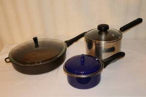 lot 134 image: Kitchen EssentialsCast Iron Haudguss Germany Titanium Double-Handle 11-Inch Skillet Pan wLid, Magefesa Mediterranean Enamelware 1-Qt. Saucepan, Wearever 3-Qt. Glass Covered Kettle,