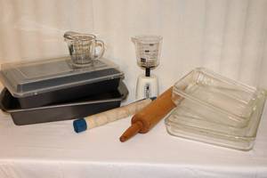 lot 137 image: Kitchen EssentialsPyrex Glass Cake Bar Pans, Wilton and Covered Cake Pan, Rolling Pin, Anchor Hocking Glass Measuring Cup Etc