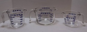 lot 165 image: Kitchen EssentialsPyrex Three-Piece Set Glass Measuring Cups