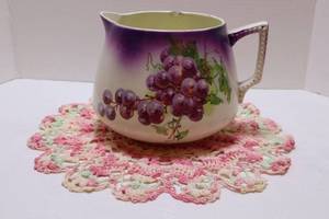 lot 183 image: Antique Dresden China Purple Glaze Grape Pitcher Cr 1890-1910 w Vintage Crocheted Doily