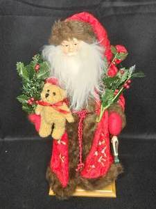 lot 106 image: 20 Red Robe Santa Figurine Holding Teddy Bear in Red Cape