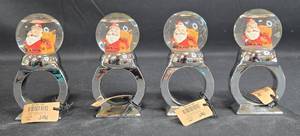 lot 85 image: Set of 4 Pier 1 Seasonal Napkin Ring Holders with Santa and Bear Design