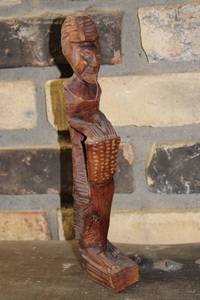 lot 23 image: Hand-Carved Wooden Figurine of a Traditional African Man with Basket