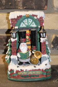 lot 27 image: North Pole Caroling Society Musical Figurine with Santa and Brass Instrument