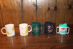 lot 56 image: Collection of 5 Vintage Decorative Mugs and a Childrens Sippy Cup