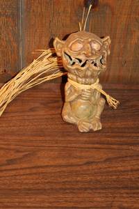 lot 128 image: Unique Handcrafted Green Ceramic Goblin Figurine with Straw Tie