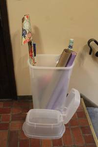 lot 165 image: Large Plastic Storage Bin with Assorted Wrapping Paper