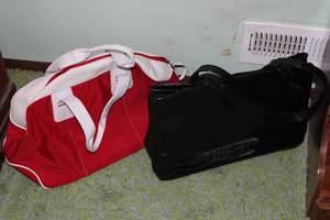 lot 222 image: Set of 2 Handbags - Coldwater Creek Black Crocodile Print and Red Weekender Bag