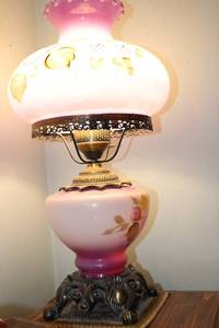 lot 244 image: Antique Pink Glass Oil Lamp with Decorative Floral Design