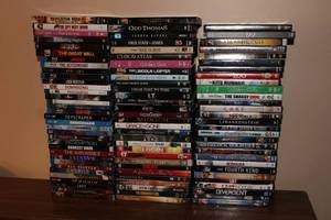lot 250 image: Lot of 50 DVDs Including Popular Titles like The Kite Runner, Sherlock Holmes, and Grace Is Gone
