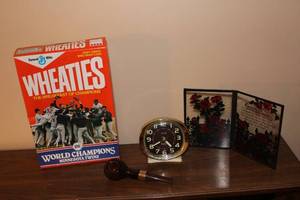 lot 268 image: Vintage Wheaties Cereal Box, Big Ben Alarm Clock, Smoking Pipe, and Decorative Plaque