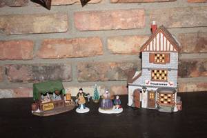 lot 294 image: Dickens Village Series Poulterer Shop with Figurines