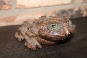 lot 317 image: Handcrafted Wooden Frog Figurine with Green Eyes