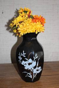 lot 376 image: Elegant Black Vase with Floral Design and Yellow Faux Flowers