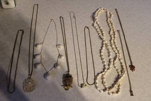 lot 383 image: Collection of 9 Vintage Necklaces with Unique Pendants