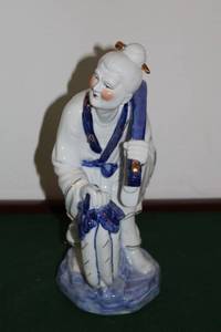 lot 34 image: Decorative Porcelain Figurine of Farmer Carrying Water Jugs