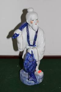 lot 37 image: Porcelain Figurine of Man with Fish