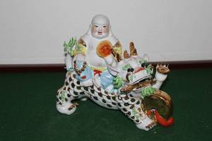 lot 39 image: Vintage Porcelain Figurine of a Monk on a Dragon